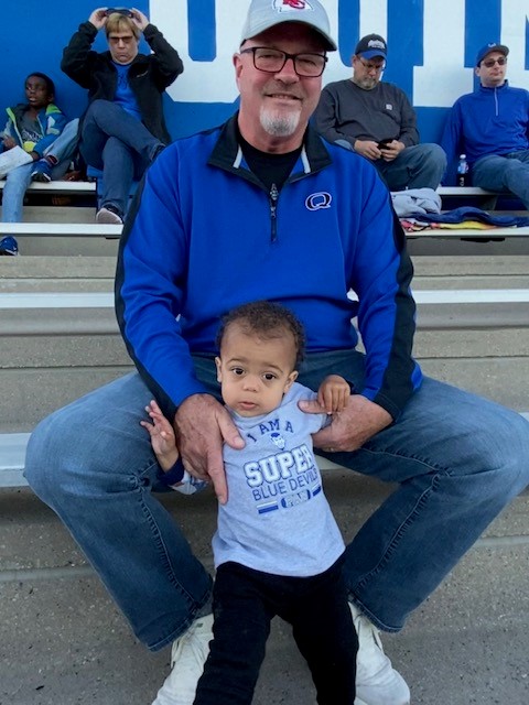 Blane Barnes with his grandson at a Blue Devil game. 