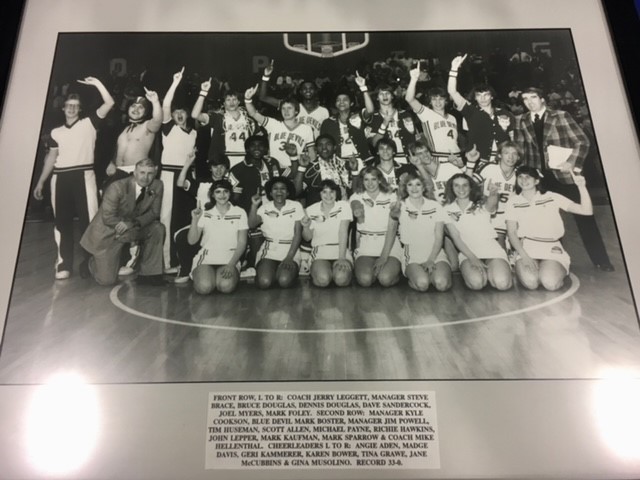 A yearbook picture of QHS cheer team.