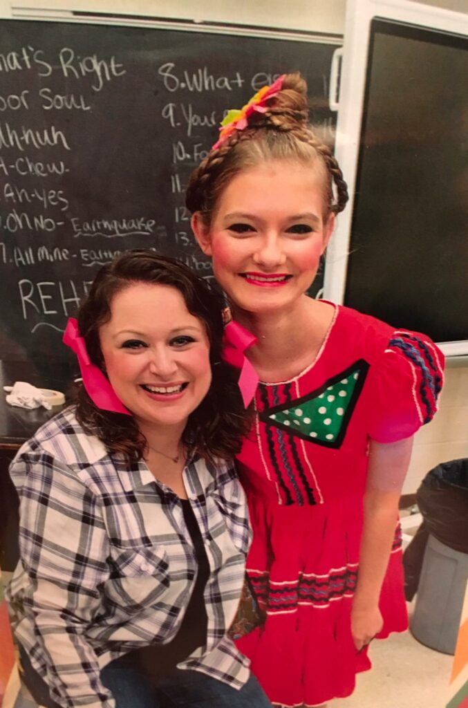 Meghan with a student during a production.