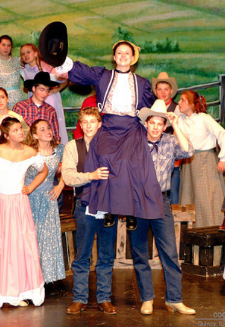 Meghan as an actor in the student production of Oklahoma!.